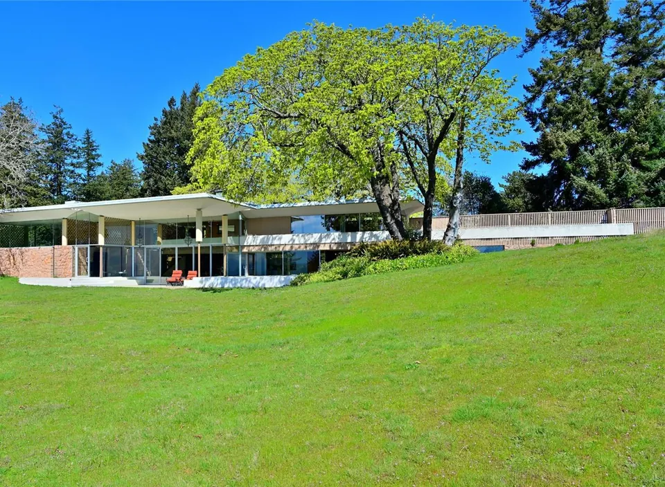 The Filberg House among mature trees and meadow