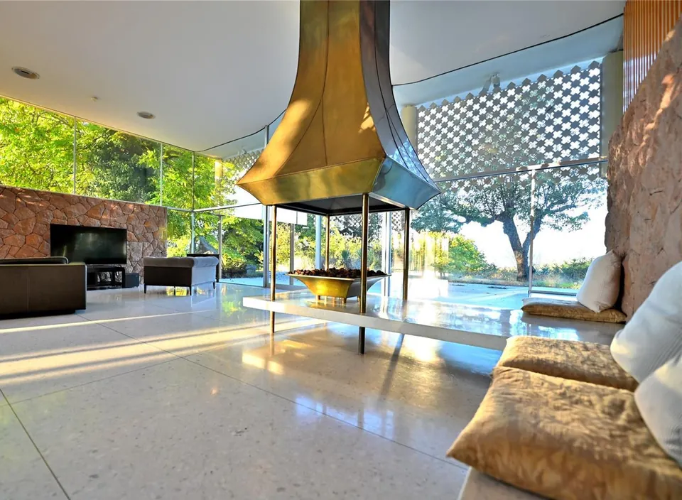 Living room with a granite fireplace
